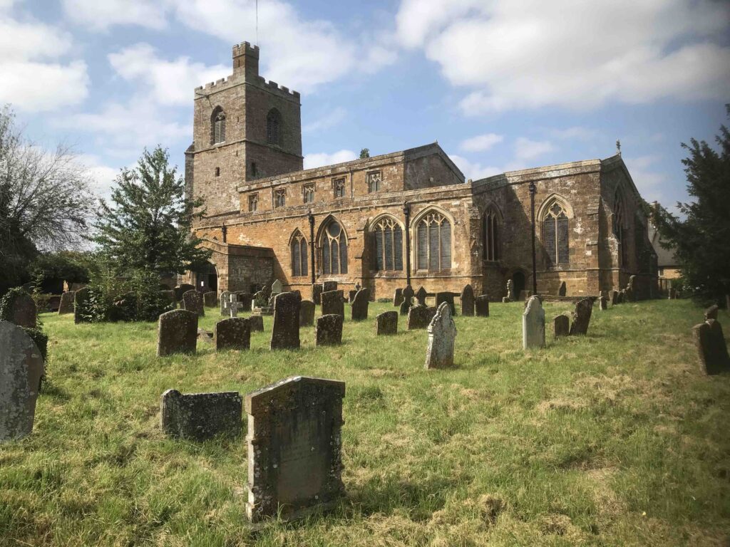 The Church at Cropredy. St Mary the Virgin. Gravestones can be seen in the foreground.